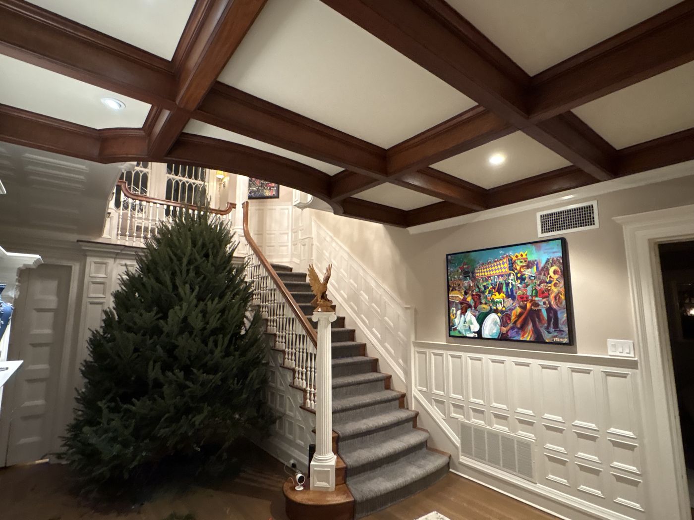 A Frenchy painting displayed on the staircase wall